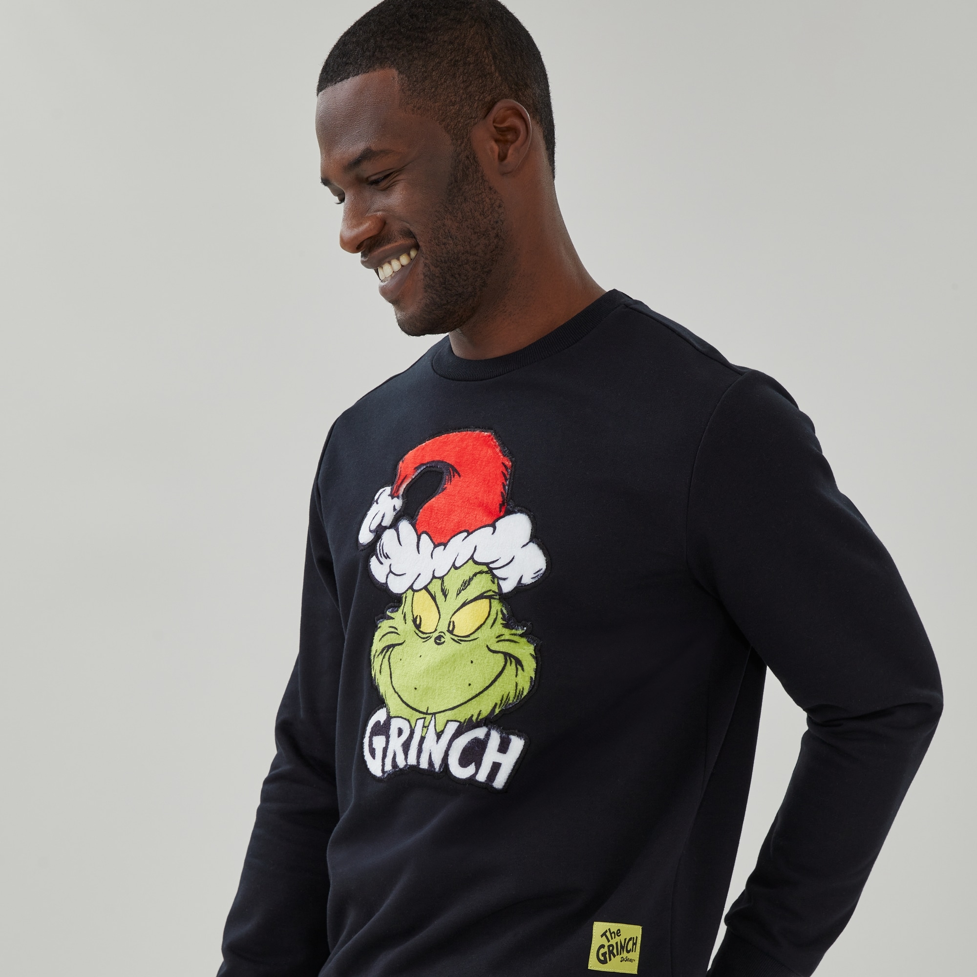 Men's Grinch Festive Graphic Sweatshirt in Black from Joe Fresh
